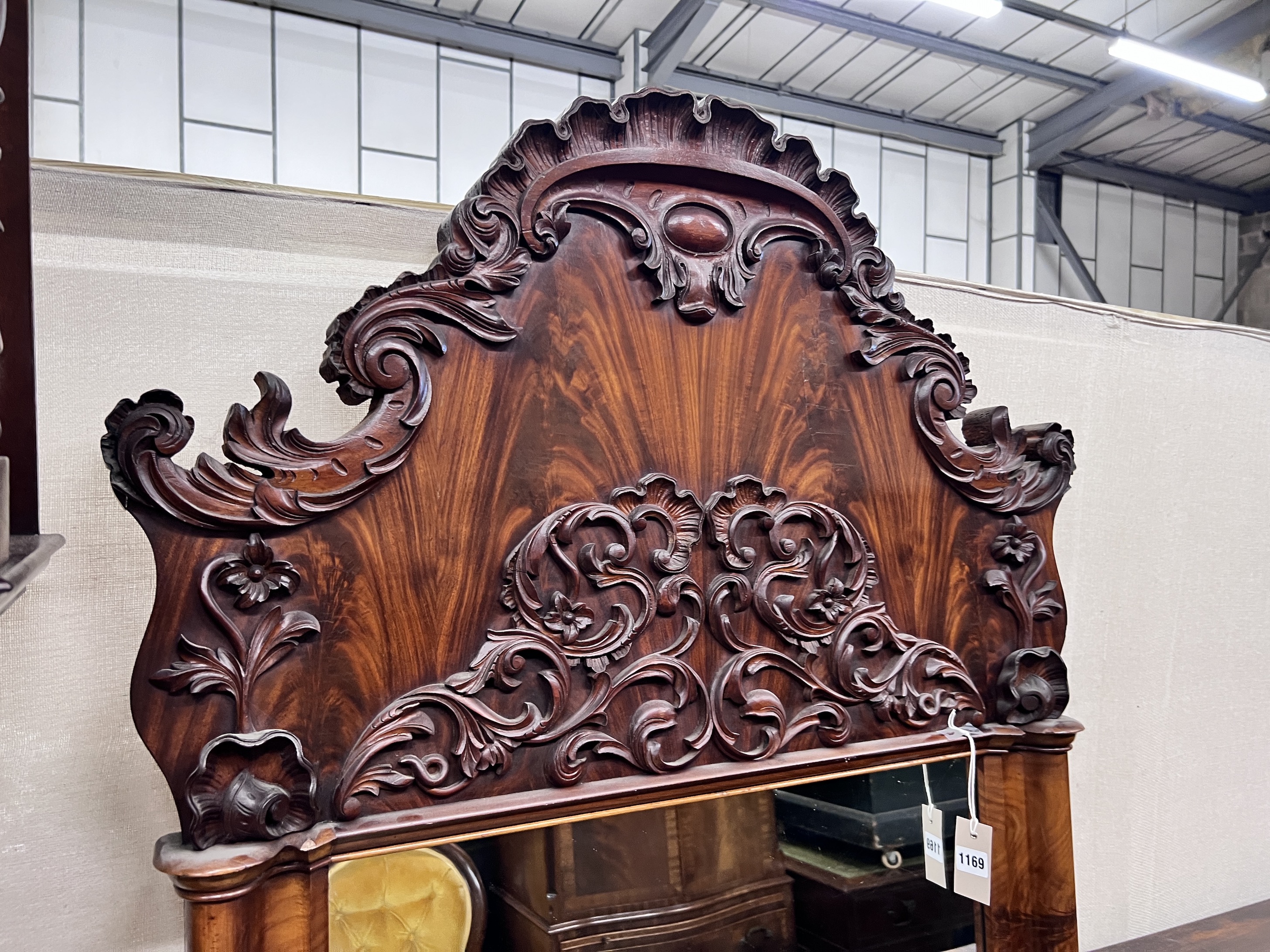 A 19th century French flame mahogany pier glass, with scroll carved pediment, width 88cm, height 193cm